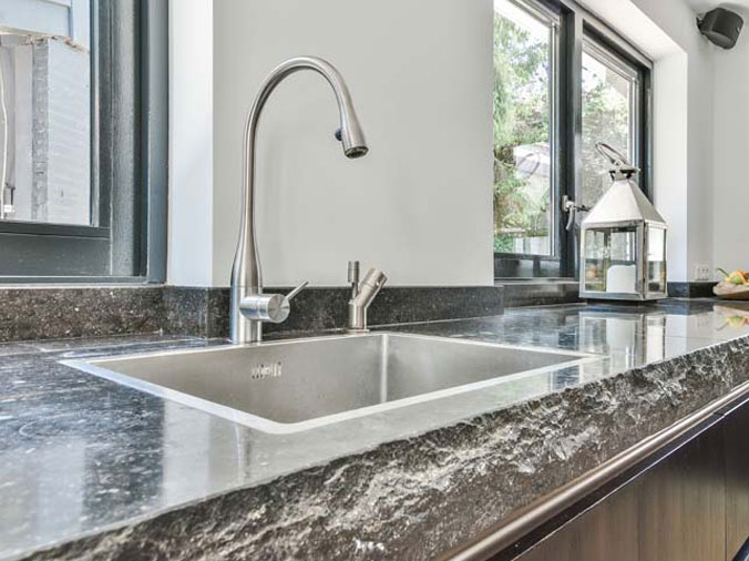 Kitchen sink with stainless gooseneck faucet