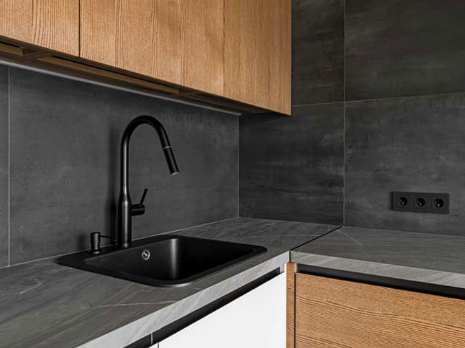 Small bar sink with black goosneck faucet