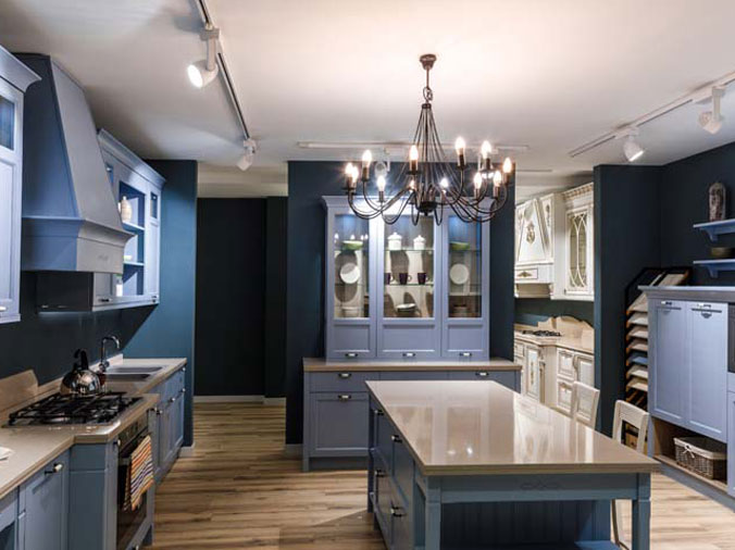 Kitchen with blue cabinets and stone countertops